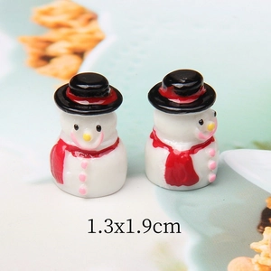 Macro detail of 1.3x1.9cm miniature resin snowmen for Christmas DIY crafts and decor