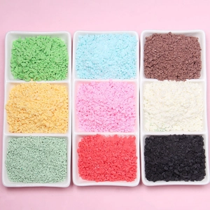 Macro shot of colorful irregular faux chocolate sprinkles in nine shades for DIY crafts