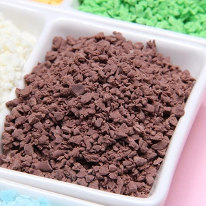 Macro shot of dark brown faux chocolate sprinkles for DIY cream glue and crafts decoration
