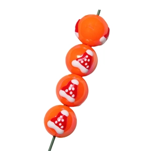 Set of four glossy orange acrylic beads with festive Santa hat patterns for DIY jewelry