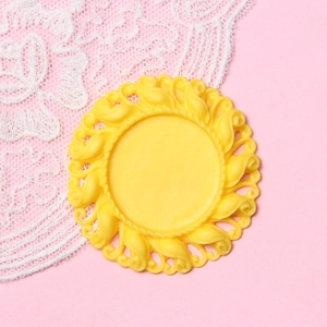 Detail of 2.5cm yellow resin cameo base with vintage baroque relief for DIY projects