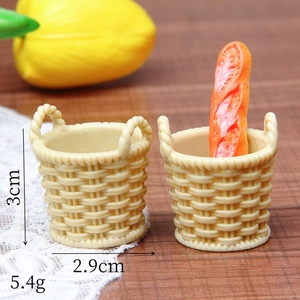 Detailed view of miniature resin woven baskets showing dimensions 3cm height and 2.9cm width