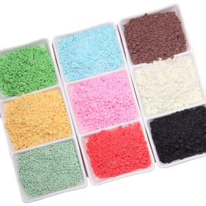 Colorful polymer clay sprinkle crumbles for DIY craft in nine grid tray display