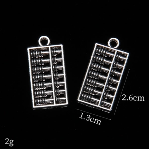 Vintage silver alloy abacus pendant for DIY jewelry, size 2.6cm by 1.3cm on black background