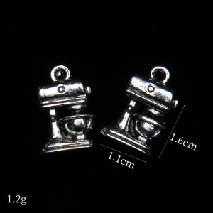 Macro detail of antique silver miniature mixer charms for DIY jewelry making with dimensions