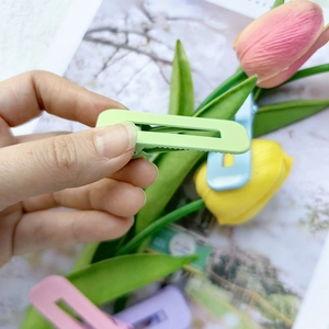 Detail of matte macaron colored hollow duckbill hair clips with anti-slip grip teeth