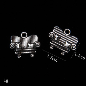 Macro shot of 1.7cm mini vintage silver alloy sofa charms for jewelry making