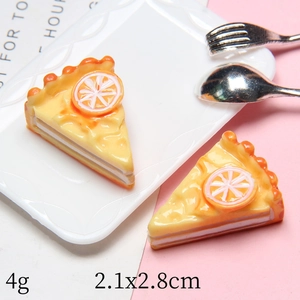 Macro shot of 2.1x2.8cm miniature resin lemon cake slice with detailed fruit toppings
