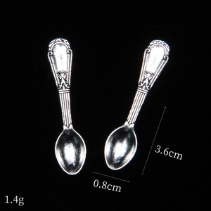 Detailed view of mini retro alloy spoons with size measurements 3.6cm and weight 1.4g