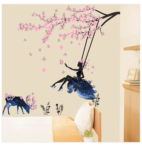 Detailed view of the starry elk and flower fairy wall sticker decor above the bed