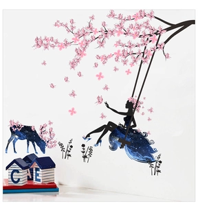 Detail view of dreamer girl and elk wall stickers with pink cherry blossom and starry sky pattern