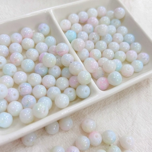 Detail of 8mm marbled ink style glass beads with pearlescent finish for DIY jewelry