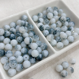 Macro detail of 8mm ink-style gradient glass beads for DIY bracelet jewelry making