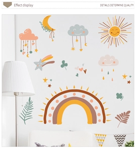 Detail of boho nursery wall stickers with rainbow, sun, and stars in soft morandi colors