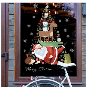Detailed view of Merry Christmas window decals with Santa and animals on glass