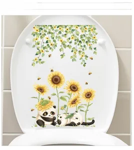Detail showing sunflower and cat wall stickers on a white toilet lid for bathroom decor