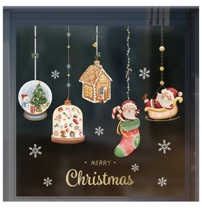 Detail of Christmas glass window stickers featuring Santa Claus and gingerbread house designs