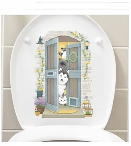 Detailed view of waterproof cartoon dog and cat stickers on a white toilet lid cover