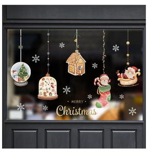 Detailed Christmas window stickers featuring snowman snow globes and Santa on dark glass