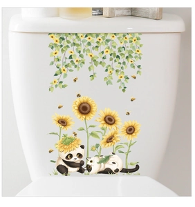 Detail of floral toilet stickers featuring sunflowers, pandas and cute cats on ceramic tank