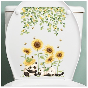 Detail of floral toilet lid decals featuring sunflower vines and cute panda cat stickers