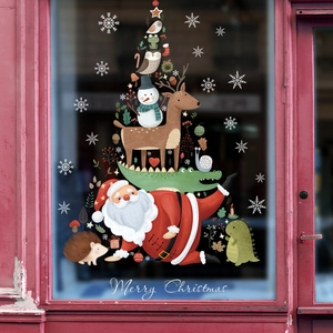 Merry Christmas window stickers featuring Santa, reindeer, and owl in a tree stack