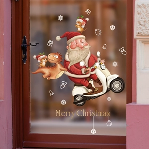 Christmas window decals with Santa on motorcycle, dinosaur, and Merry Christmas text
