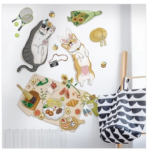 Detailed view of cute cartoon cat and dog picnic wall stickers on a clean white wall