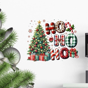 Christmas tree and HO HO HO wall sticker with colorful gift boxes on a white wall