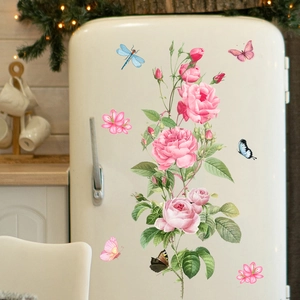 Detail of pink watercolor rose wall stickers with butterflies on a vintage refrigerator
