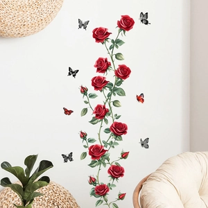 Detail of red rose and butterfly wall decals applied to a modern living room setting