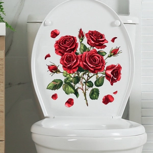 Detail of red rose toilet lid decals with vibrant floral clusters and green leaves