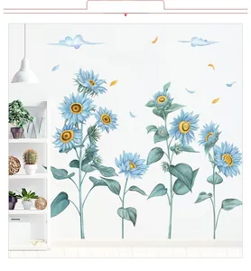 Stickers muraux tournesols bleus avec nuages et texte dans un salon moderne et minimaliste