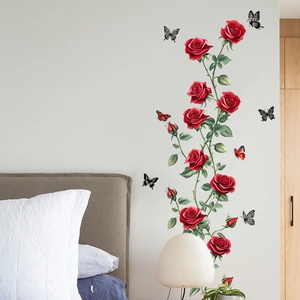 Waterproof wall stickers featuring red roses, green vines, and colorful butterflies in a bedroom
