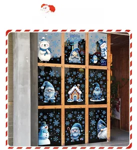 Detail of Christmas window stickers featuring blue gnomes, polar bears and snowflakes