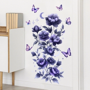 Detail of purple floral wall decals with 3D butterflies and moon stars on white wall