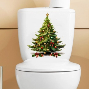 Detail showing a Christmas tree decal with gold stars and red bows on a white toilet tank