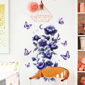 Detail of purple floral vine wall sticker with butterflies and moon in cozy bedroom setting