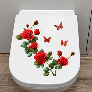 Close-up of red rose and butterfly waterproof self-adhesive wall stickers on a white toilet lid