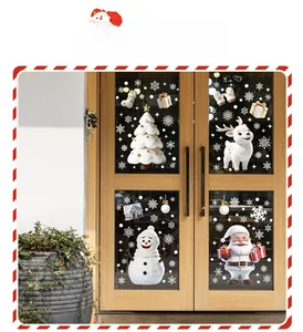 Detail view of 3D Christmas window stickers with Santa and reindeer on glass door