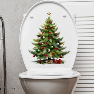 Detail of Christmas tree toilet lid sticker with red bows and gold star ornaments