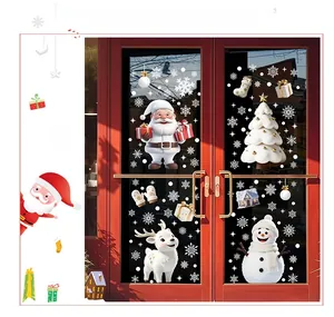 Detail of festive Santa and snowman static window stickers on red glass doors