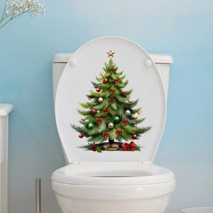 Detail of Christmas tree toilet lid sticker with red bows and ornaments on white ceramic