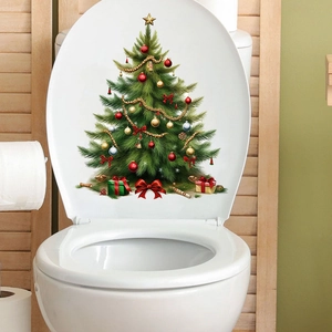Close-up of a festive Christmas tree sticker with ornaments on a white toilet lid