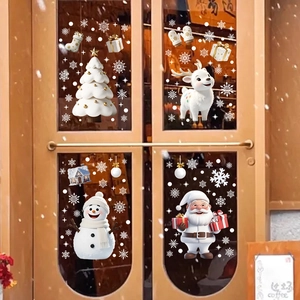 Christmas static window decals featuring Santa, snowman, and reindeer on shop door