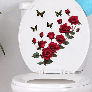 Detail of waterproof red rose and butterfly decals applied on a white toilet lid cover
