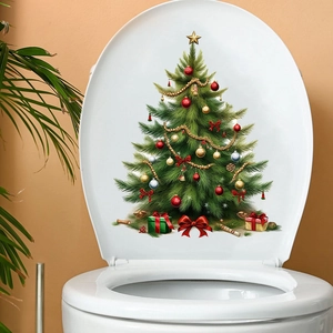 Detail of Christmas tree wall sticker with ornaments on a white toilet lid surface