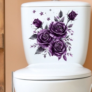 Close-up of purple rose stickers with stars applied to a white ceramic toilet tank