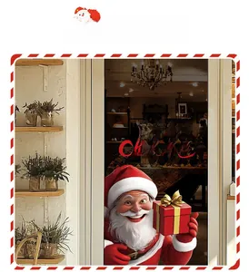 Detail view of Santa Claus window stickers with Merry Christmas text on a glass door