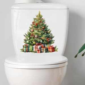 Detail of Christmas tree wall sticker with gift boxes applied on a white surface